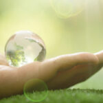 close-up-green-planet-your-hands-save-earth (1)